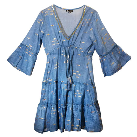 A blue cotton print dress with gold fishes pattern, tiered skirt, and flared sleeves with gold foil accents