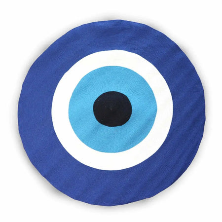Blue circular cotton rope cushion with concentric white light blue rings and black center inspired by evil eye design