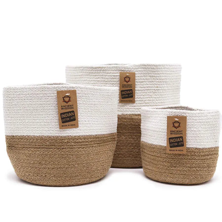 Set of three white and natural brown cotton rope storage baskets made from indian cotton-jute for home organization
