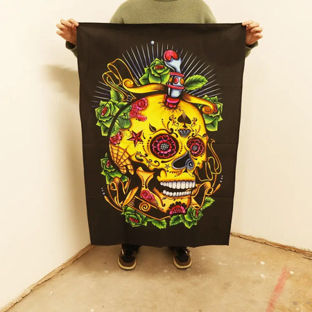 Vibrant yellow sugar skull cotton wall art banner with pink roses green leaves and gold details on black background