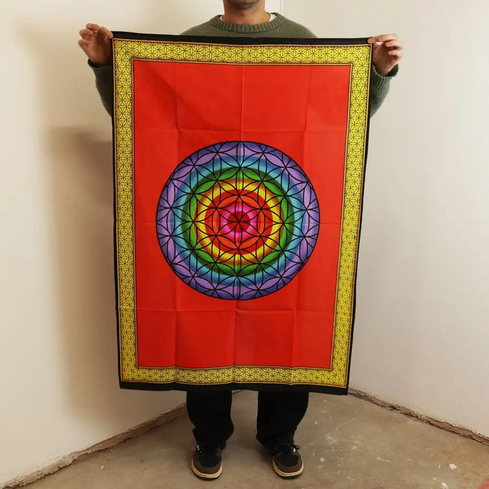 Cotton wall art with vibrant red tapestry featuring a colorful geometric mandala framed by a yellow patterned border