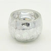 Silver crackled glass tealight holder with a reflective textured surface for decorative lighting