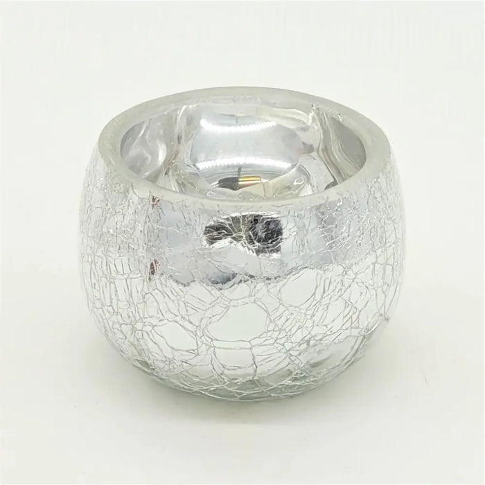 Silver crackled glass tealight holder with a reflective textured surface for decorative lighting