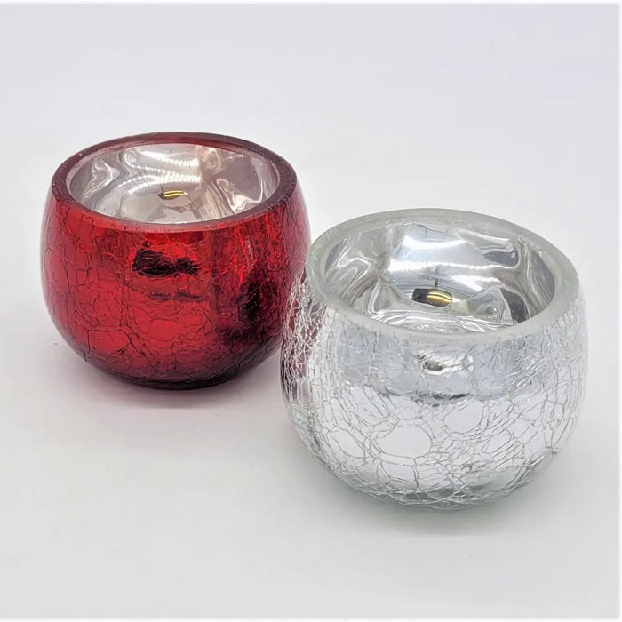 Red and silver crackled glass tealight holders with metallic interiors for decorative use as glass tealight holders