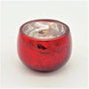 Red glass tealight holder with crackle finish and reflective silver interior for decorative lighting
