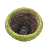 A weathered green terracotta plant pot with a crackle glaze, textured chips, and a rust-stained interior