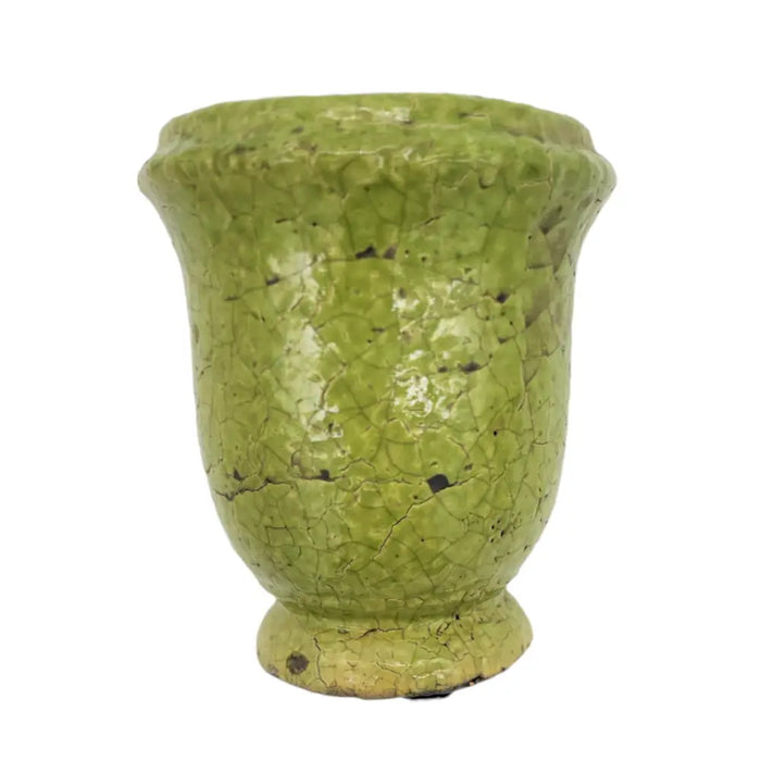 A vintage-style green ceramic plant pot with crackled terracotta glaze and subtle dark speckles