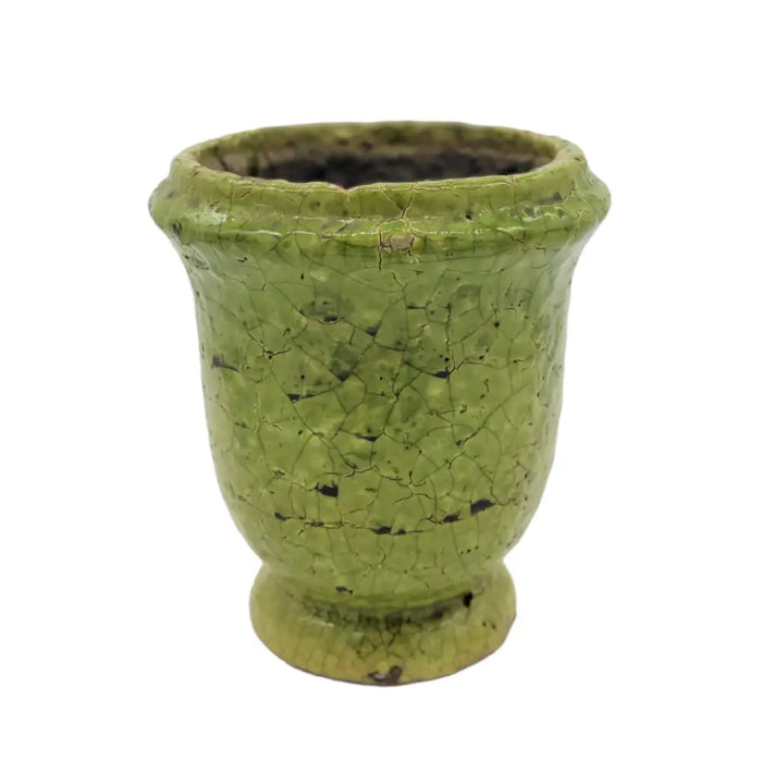 A vintage-style green ceramic plant pot with crackle glazed terracotta finish and subtle black speckles