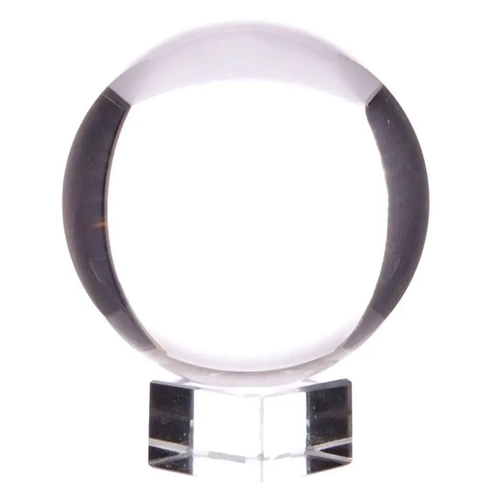 Clear crystal ball with black bands made of optical glass on a transparent acrylic stand 150mm size