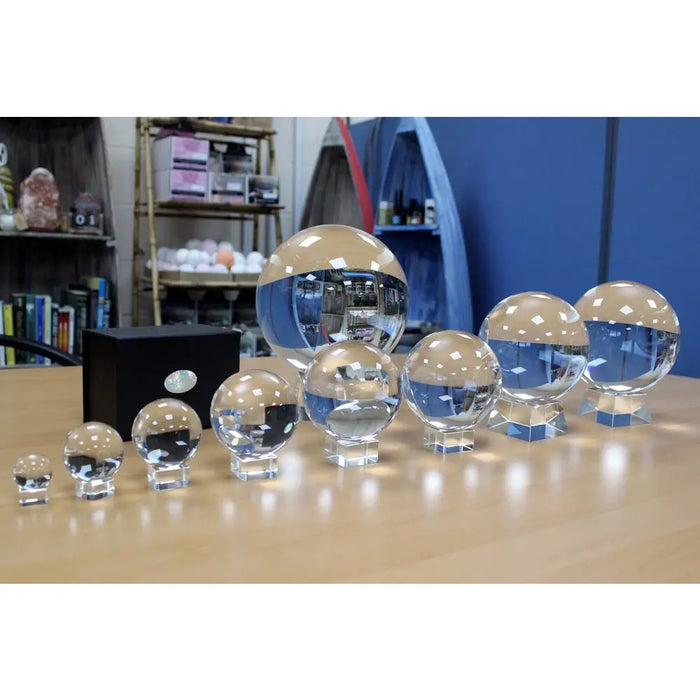 Crystal ball on stand 200mm with clear optical glass spheres of varying sizes on matching crystal bases