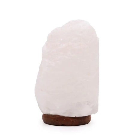 A white crystal rock himalayan salt lamp with smooth translucent surface and dark wooden base showing hygroscopic properties