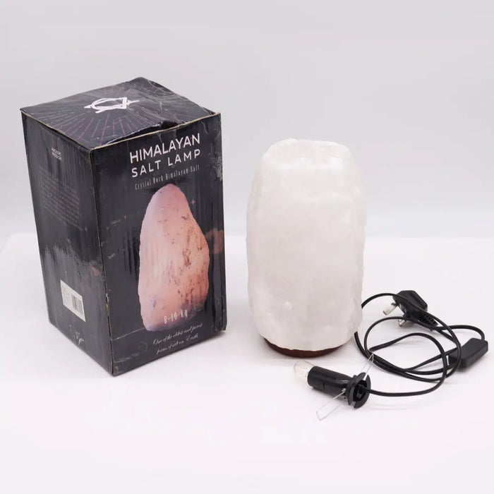 A translucent crystal rock himalayan salt lamp with a rough pinkish-white texture showing its hygroscopic properties