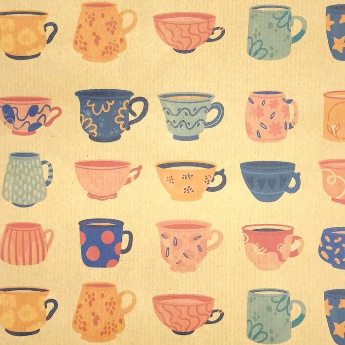 A collection of ceramic mugs in pastel tones with patterns shown on recycled kraft paper gift wrap sheet