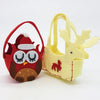 Red felt owl-shaped treat bag with closed eyes brown feet and santa hat from cute little felt treat bags collection