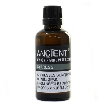 A dark amber glass bottle of cypress essential oil 50ml with a black cap labeled ancient wisdom allergen declarations steam distillation