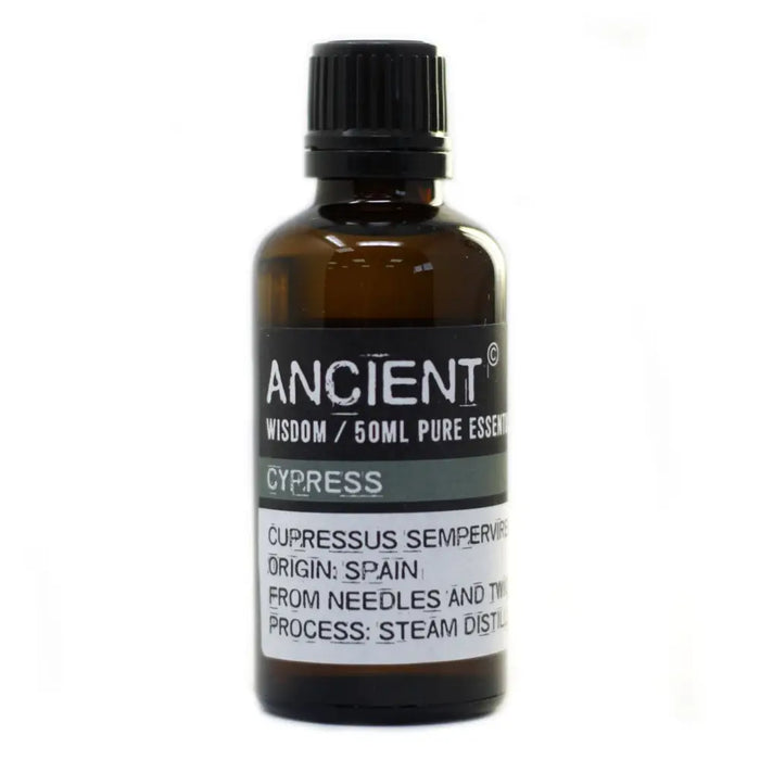 A dark amber glass bottle of cypress essential oil 50ml with a black cap labeled ancient wisdom allergen declarations steam distillation