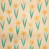 Beige recycled kraft wrapping paper with a repeating pattern of yellow daffodils and green stems gift wrap sheet