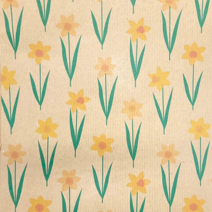 Beige recycled kraft wrapping paper with a repeating pattern of yellow daffodils and green stems gift wrap sheet