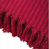 A rich red recycled cotton striped throw with ribbed texture and fringed edges in pink striped throw style