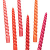 Daisy snow six twisted dinner candles in coral orange and pink hues with smooth coconut oil wax finish