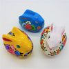 Three hand-painted ceramic rabbit trinket boxes in kashmiri style by dalit goods in blue yellow and white with floral designs