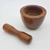 A smooth polished sheesham wood mortar and pestle set with a rich brown finish from Dalit Goods Co