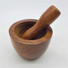 A smooth rich brown sheesham wood mortar and pestle set with rounded bowl and matching handle by dalit goods