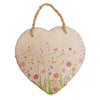 A rustic heart-shaped slate plaque with a bright pink orange and yellow floral design for découpage decor