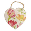 A heart-shaped slate plaque with painted pink yellow and red tulips on cream background and twine loop hanging