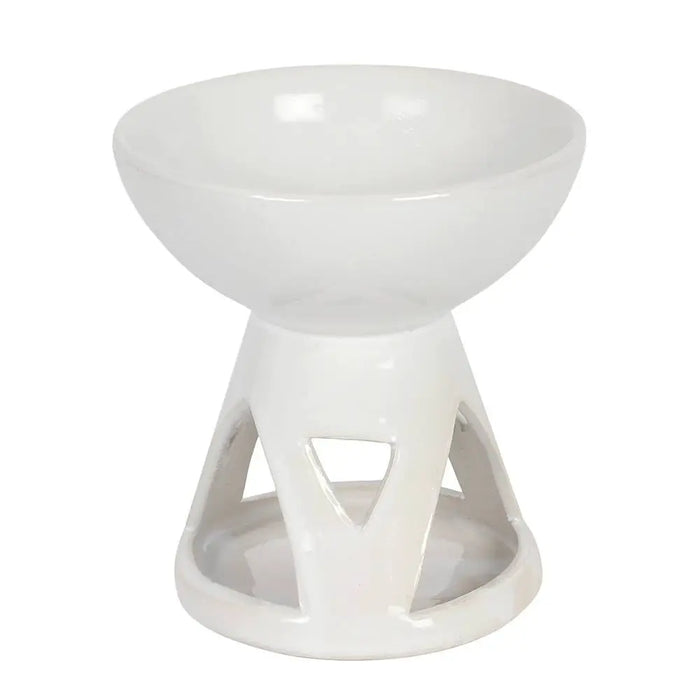 Deep bowl ceramic oil burner in white with glossy finish and geometric cutouts on the base for essential oils