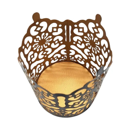 Brown metal owl-shaped votive candle holder with intricate die-cut patterns in black and gold prussian style metal votive