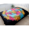 Double cotton bedspread with vibrant rainbow tie-dye and black hamsa mandala design used as wall hanging on bed