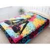 Vibrant tie-dye double cotton bedspread with a black meditating figure and colorful chakra symbols and stars