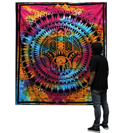 Vibrant cotton bedspread with a psychedelic tie-dye hamsa hand and geometric patterns in rainbow colors