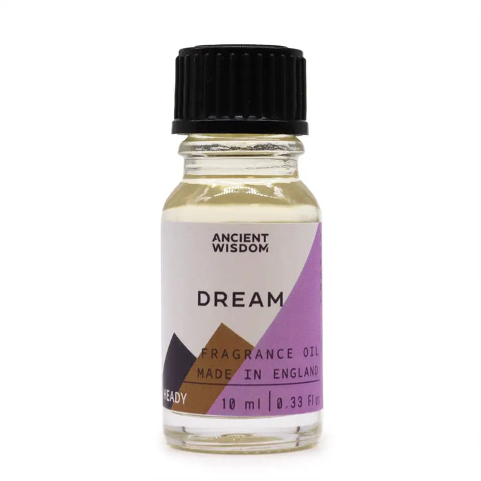 A clear glass bottle with pale yellow dream fragrance oil and black cap labeled ancient wisdom dream with allergen declarations