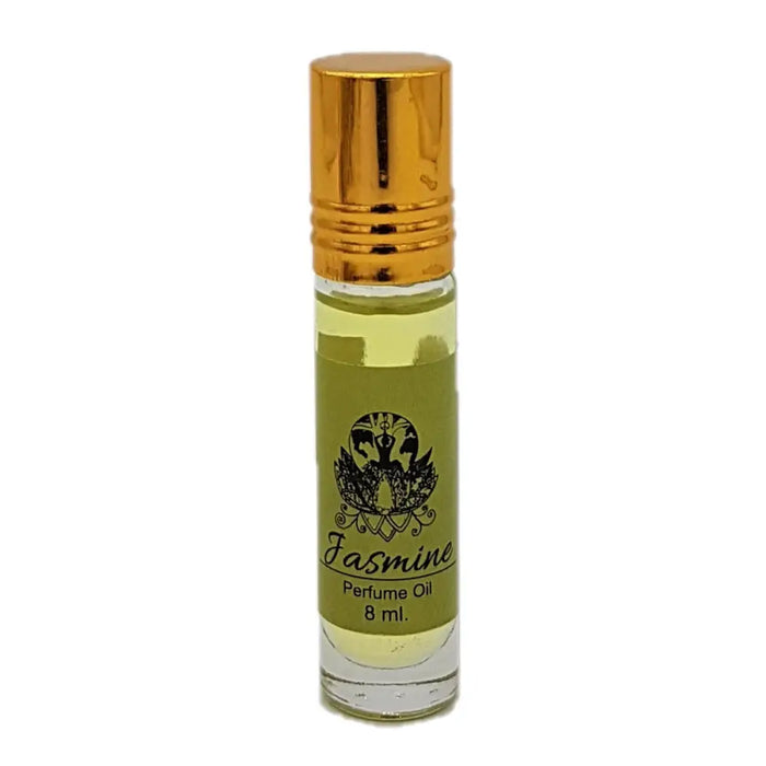 A small clear glass bottle with golden cap and olive green jasmine label of dream spirit roll-on perfume oil