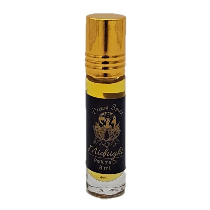 A sleek 8 ml glass roll-on bottle with golden cap and black label with gold lettering for dream spirit perfume oil
