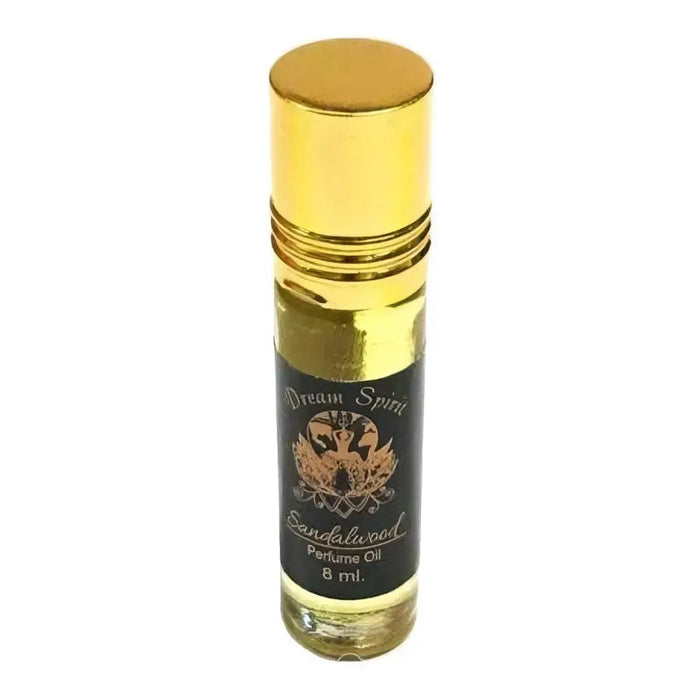 A sleek 6ml roll-on dream spirit perfume oil bottle with a golden cap and black label featuring gold lettering