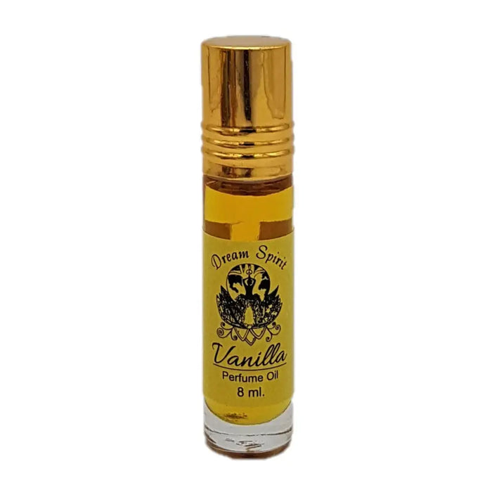 A small clear glass bottle of dream spirit perfume oil with a gold cap and yellow label for roll-on use