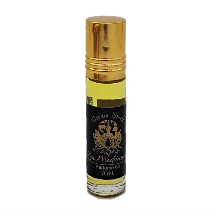 A sleek 8 ml glass dream spirit perfume oil rollerball with a gold cap and black label with golden text