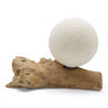 A driftglow lamp with a white cotton wrap shade and textured paper lantern on a natural driftwood base