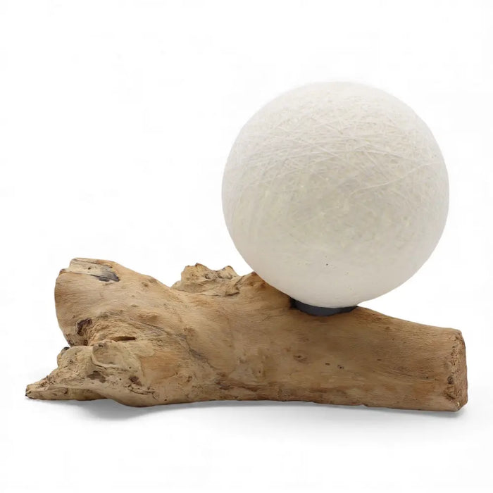A driftglow lamp with a white cotton wrap shade and textured paper lantern on a natural driftwood base