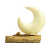 Cream-colored ceramic half-moon shade with crackled glaze on rustic driftwood base featuring fibreglass half-moon style