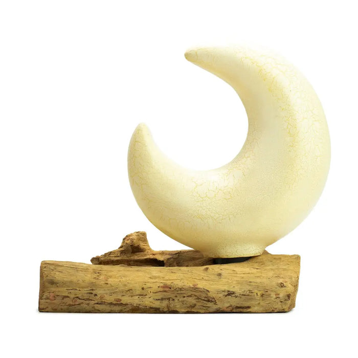 Cream-colored ceramic half-moon shade with crackled glaze on rustic driftwood base featuring fibreglass half-moon style