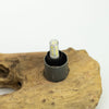 Clear glass led bulb with yellow leds in a black base inside a driftglow lamp with a grey fibreglass half-moon shade