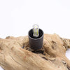 Black cylindrical driftglow lamp led bulb with clear glass housing and visible greenish yellow leds in fire egg shade