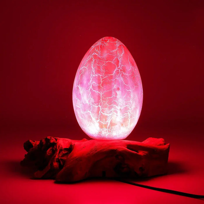 A driftglow lamp shaped like a translucent egg with a crackled white pattern and soft pink orange crackle fire egg shade