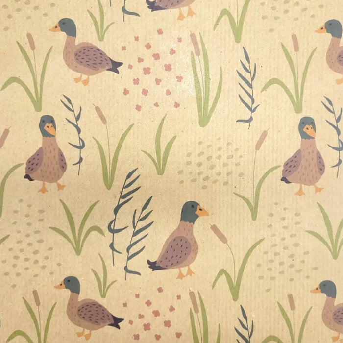 Beige recycled kraft wrapping paper with duck print featuring gray head brown body orange beak among green reeds
