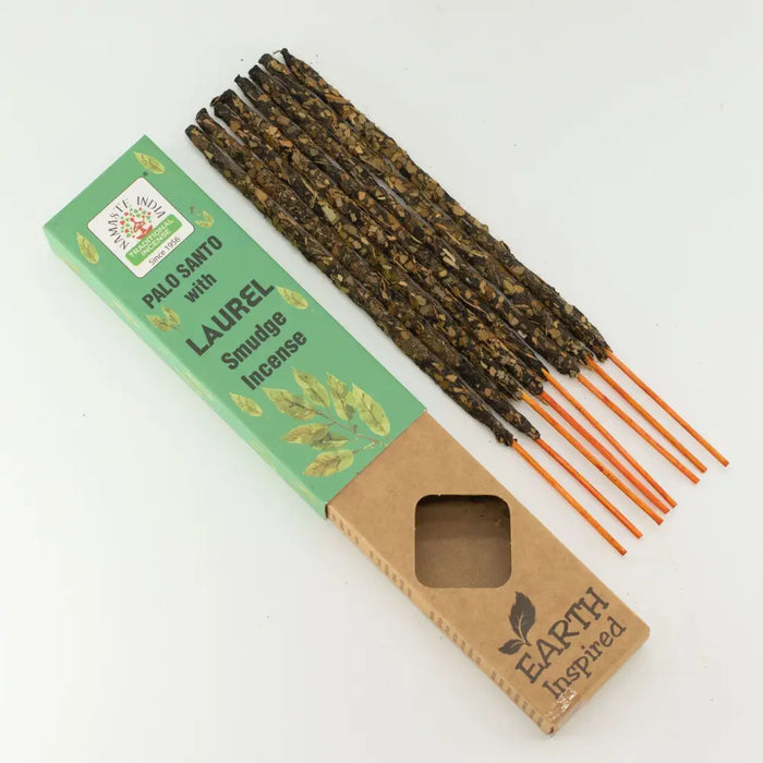 A set of earthy brown palo santo incense sticks with orange wooden wicks for earth inspired smudge use