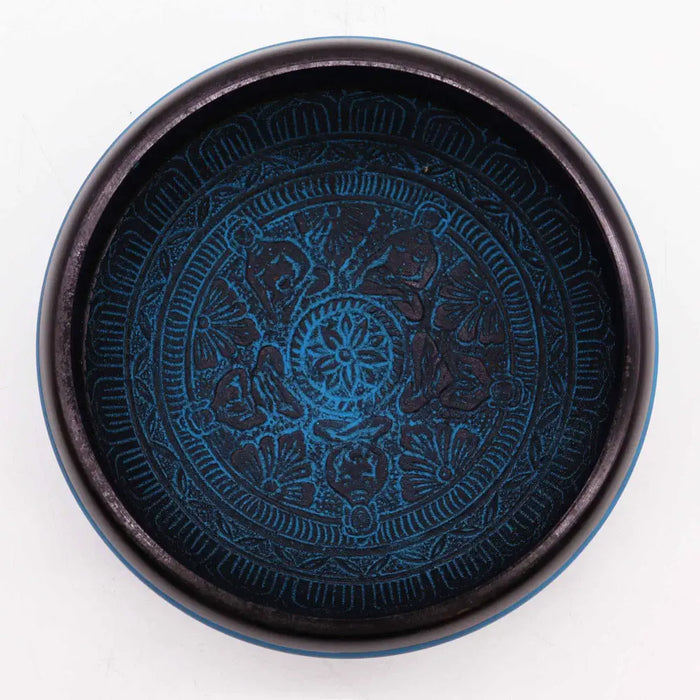 Dark blue ceramic earth powder singing bowl with embossed floral and figure patterns from blue mantra five buddha series